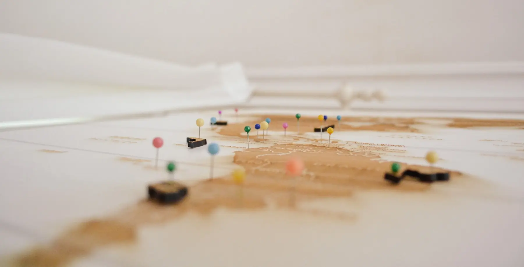 Travel map marked with colored pins along a planned route